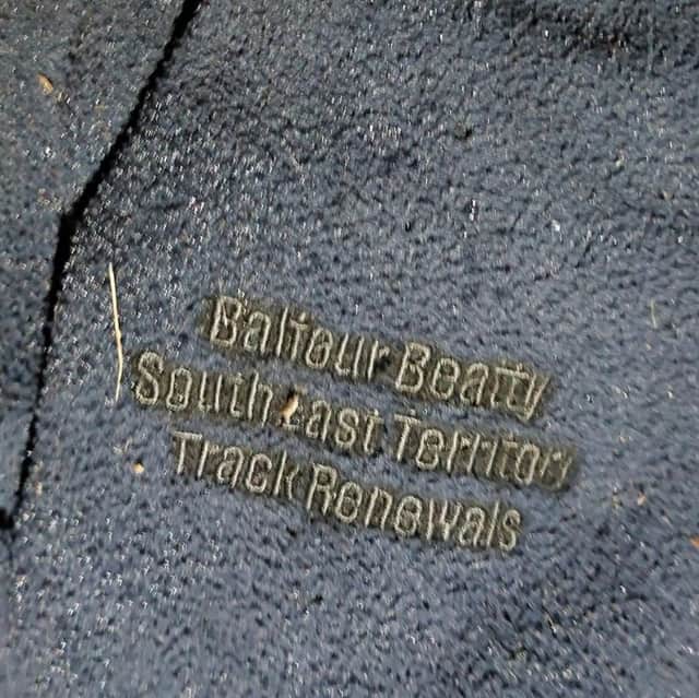 The fleece the man was wearing has Balfour Beatty South East Territory Track Renewals written on it.