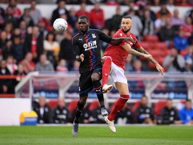 Pompey's Alex Milosevic, right, challenges Crystal Palace's Christian Benteke while with Nottingham Forest.  Pic: Getty Images