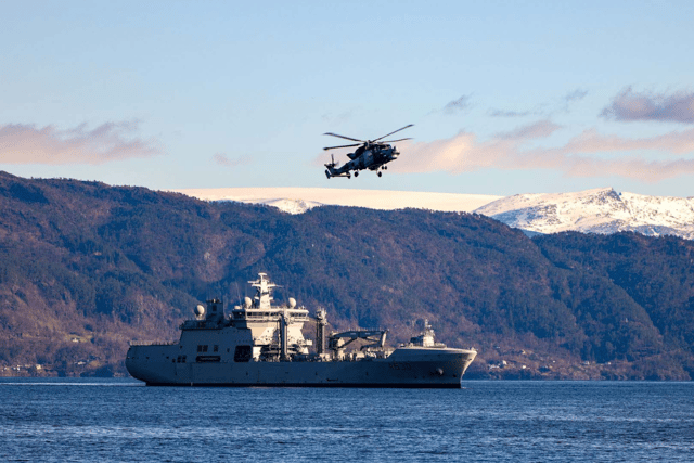 "Advanced techniques" have been developed between Royal Navy and Norwegian forces ahead of HMS Prince of Wales' upcoming Indo-Pacific deployment. Pictured: A Wildcat helicopter passing over Norwegian tanker HNoMS Maud.