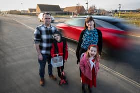 The Mahaffey family, James and Lisa with their children, Rhys, 9, and Freya, 6. They are calling for better road safety measures outside Berewood Primary School, Waterlooville, after their children were nearly hit by a speeding driver while on their way to school.