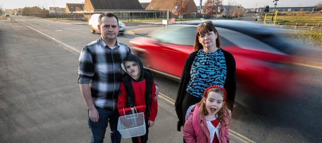 The Mahaffey family, James and Lisa with their children, Rhys, 9, and Freya, 6. They are calling for better road safety measures outside Berewood Primary School, Waterlooville, after their children were nearly hit by a speeding driver while on their way to school.