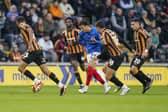 Andre Dozzell in the thick of the action at Hull in November - a 1-1 draw which marked a new playing style for Pompey. Picture: Jason Brown/ProSportsImages