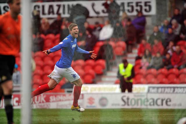 Marko Futacs celebrates his stoppage-time win against Doncaster in April 2012. Picture: Steve Reid