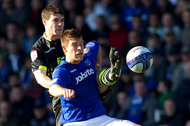 Marko Futacs holds off a challenge from Leeds' Darren O'Dea in February 2012. Picture: Ben Hoskins/Getty Images