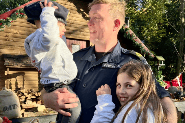 Eleanor and Joshua Powlesland alongside their father Adam, who is a Chief Petty Officer in the Royal Navy.
