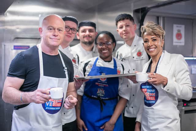 Pictured: Ross Kemp and Dame Kelly Holmes with kitchen crew of HMS Duncan for the VE Day 80 street party in Portsmouth.