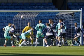 Pompey defend Millwall's pressure in today's 2-1 defeat. Pic Jason Brown/ProSportsImages