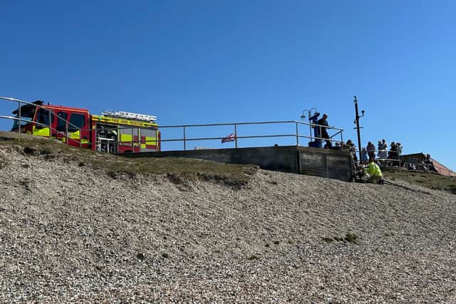 Fire crews are tackling a blaze on the beach in Lee-on-the-Solent. Smoke can be seen coming out from below the walkway with firefighters trying to reach it from what appears an awkward angle.