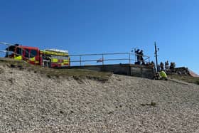 Fire crews are tackling a blaze on the beach in Lee-on-the-Solent. Smoke can be seen coming out from below the walkway with firefighters trying to reach it from what appears an awkward angle.