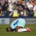 Christian Saydee agonises over yet another Pompey defeat on their travels, this time at Millwall on Saturday. Picture: Jason Brown/ProSportsImages