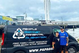 Simon Cobb with his son in front of the Spinnaker Tower. The Portsmouth landmark will light up green on April 25 to mark Parental Alienation Awareness Day.