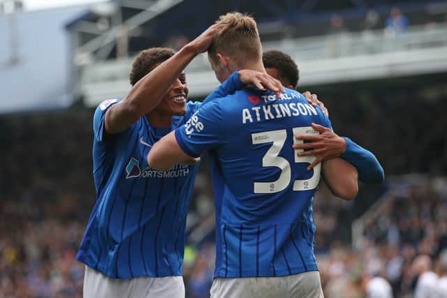 Rob Atkinson's stoppage-time header secured a late point for Pompey against Derby.