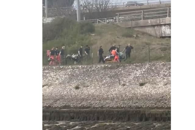Two men are stretchered after crash beneath M275