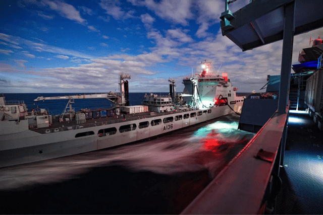 RFA Tidespring and RFA Argus will both be deployed alongside HMS Prince of Wales during her mission in the Indo Pacific region. Pictured: RFA Tidespring carrying out a replenishment at sea drill with the Royal Navy flagship.