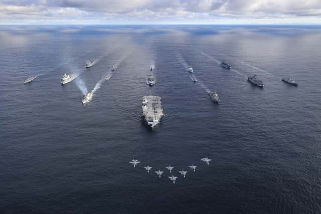 HMS Prince of Wales previously leading a carrier strike group, alongside a Nato Amphibious Task Group. 