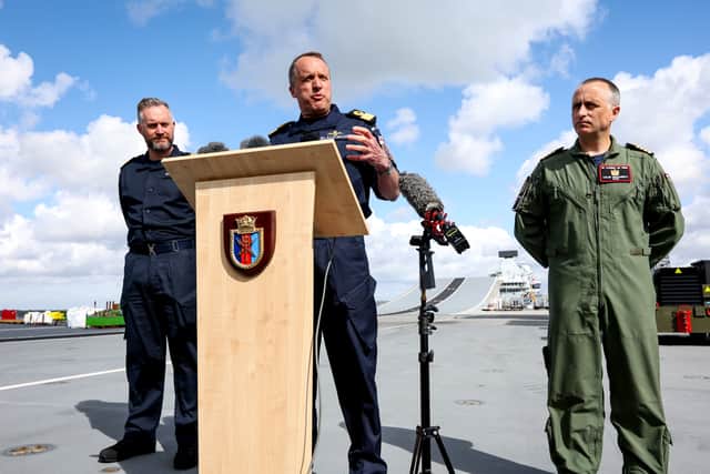 From left, Captain Will Blackett RN, Commanding Officer of HMS Prince of Wales; Commodore James Blackmore RN, Commander Carrier Strike Group; and Captain Colin McGannity RN, Commander Air Group, on the flight deck of HMS Prince of Wales as they brief the press about Operation Highmast.