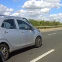 A police motorcycle spotted this driver taking a selfie while driving on the motorway.
