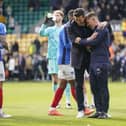 John Mousinho and assistant Jon Harley celebrate a remarkable 5-3 success at Norwich. Picture: Jason Brown/ProSportsImages