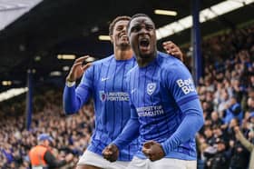 Christian Saydee and Kusini Yengi celebrate Pompey securing their Championship status following a 1-0 win over Watford. Picture: Jason Brown/ProSportsImages