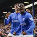 Christian Saydee and Kusini Yengi celebrate Pompey securing their Championship status following a 1-0 win over Watford. Picture: Jason Brown/ProSportsImages