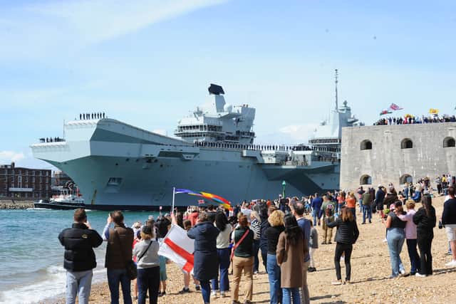 Large crowds gathered along the Hot Walls in Old Portsmouth to watch HMS Prince of Wales leave the city for a major Royal Navy Carrier Strike Group deployment to the Indo-Pacific on Tuesday, April 22 2025.
