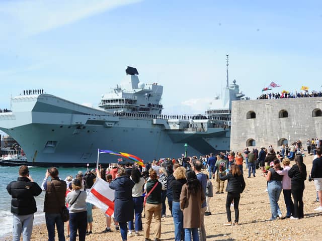 Large crowds gathered along the Hot Walls in Old Portsmouth to watch HMS Prince of Wales leave the city for a major Royal Navy Carrier Strike Group deployment to the Indo-Pacific on Tuesday, April 22 2025.