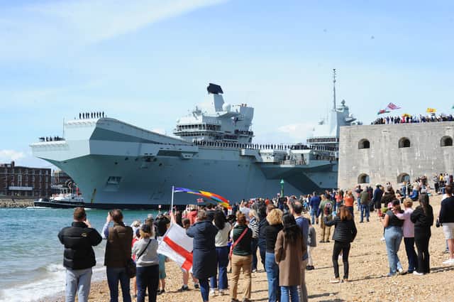 Large crowds gathered along the Hot Walls in Old Portsmouth to watch HMS Prince of Wales leave the city for a major Royal Navy Carrier Strike Group deployment to the Indo-Pacific on Tuesday, April 22 2025.