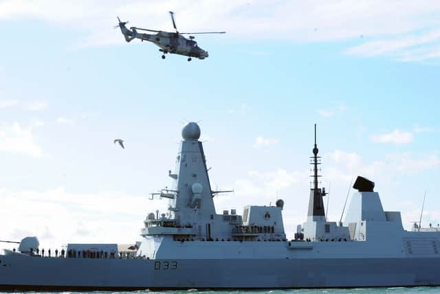 Families gather to watch HMS Dauntless leave Portsmouth on Tuesday, April 22, 2025. 