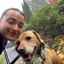 Rebecca McBride, chaperoning a dog.