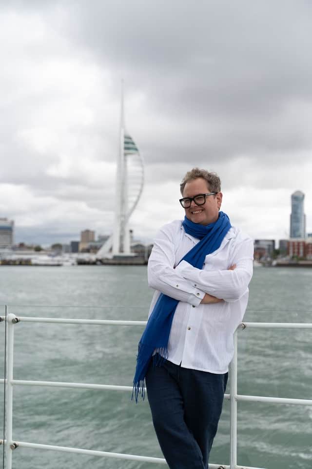 Alan Carr with the Spinnaker Tower in the background