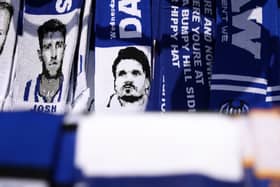 A scarf depicting Danny Röh for sale outside Hillsborough. There's uncertainty surrounding the Sheffield Wednesday boss' future heading into Saturday's game against Pompey