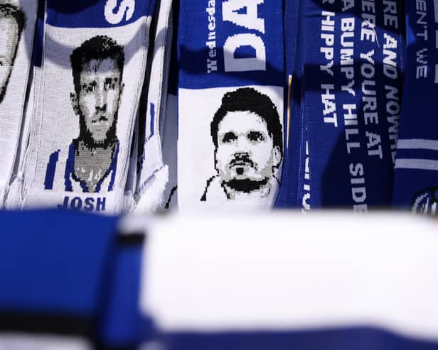 A scarf depicting Danny Röh for sale outside Hillsborough. There's uncertainty surrounding the Sheffield Wednesday boss' future heading into Saturday's game against Pompey