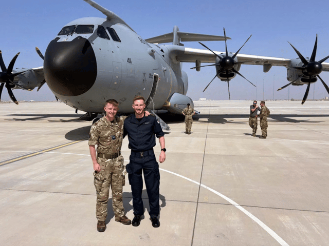 Cpl Alex and Petty Officer Andrew Warry, from Portchester, meeting up on a security mission in the Middle East. PO Warry is deployed on HMS Lancaster.