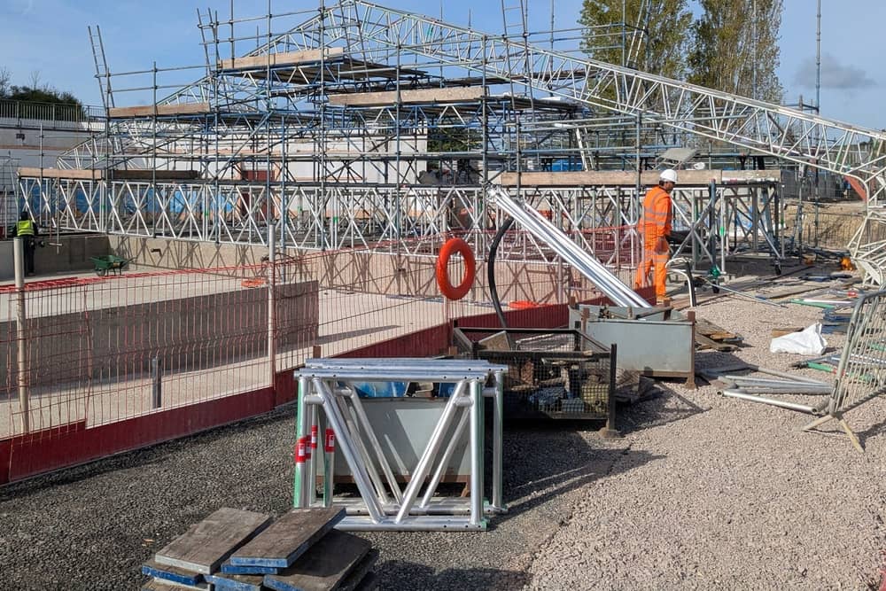The big tent to protect the pool during tiling and painting has started to take shape. 