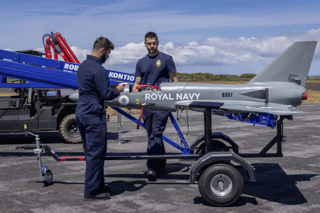 The team from the Royal Navy's 700X Naval Air Squadron with their Banshee jet-powered drones.
