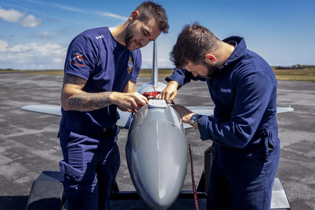 The team from the Royal Navy's 700X Naval Air Squadron with their Banshee jet-powered drones.
