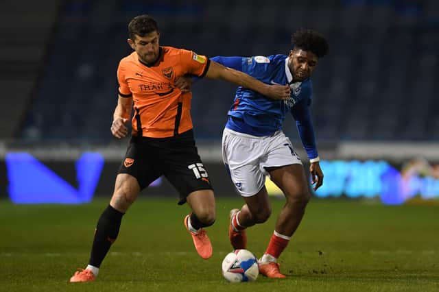 John Mousinho featuring for Oxford United battles with Pompey's Ellis Harrison at Fratton Park in November 2020. Picture: Mike Hewitt/Getty Images