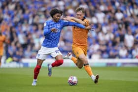 Harvey Blair attempts to get past Sean McLoughlin during Pompey's game v Hull
