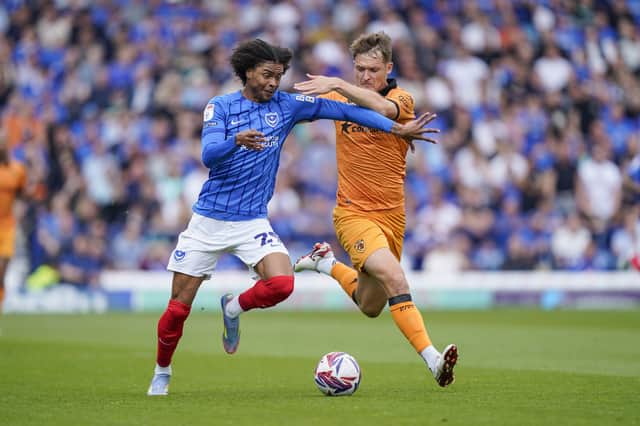 Harvey Blair attempts to get past Sean McLoughlin during Pompey's game v Hull