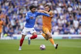 Harvey Blair attempts to get past Sean McLoughlin during Pompey's game v Hull