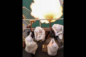 Members of the ceremonial firing party conducting the 21 gun salute to mark the anniversary of the Coronation of King Charles onboard HMS Queen Elizabeth on 6th May 2025