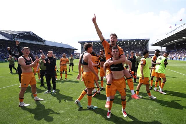 Hull City stayed up on the final day after a point against Pompey.