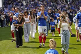 Pompey defender Rob Atkinson, centre, with his the family of Pompey players after the Hull draw. Pic: Jason Brown/ProSportsImages