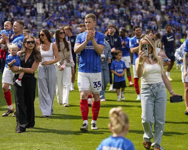 Pompey defender Rob Atkinson, centre, with his the family of Pompey players after the Hull draw. Pic: Jason Brown/ProSportsImages