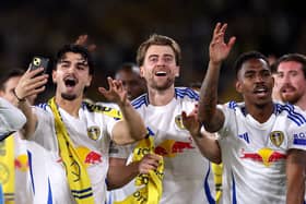 Patrick Bamford celebrates Leeds' return to the Premier League as Championship winners