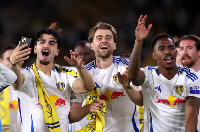 Patrick Bamford celebrates Leeds' return to the Premier League as Championship winners