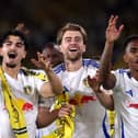 Patrick Bamford celebrates Leeds' return to the Premier League as Championship winners