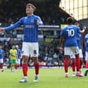 Freddie Potts celebrates in front of the Pompey fans at Carrow Road after the lues thumped the Canaries 5-3 on Good Friday