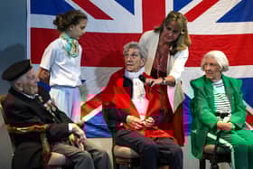 The Portsmouth Historic Dockyard hosted a VE day event  where veterans were interviewed about their wartime memories. 

Pictured: Charlotte, 12, asking a question. 
From left, Robin Boodle who was an able seaman in the Battle of The Atlantic, Mabel Kidney of the WRNS and Dorothy Walsh who worked at Bletchley Park with Alan Turing on the Enigma machine. 

Picture: Chris Moorhouse (100525-33)