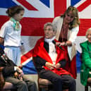 The Portsmouth Historic Dockyard hosted a VE day event  where veterans were interviewed about their wartime memories. 

Pictured: Charlotte, 12, asking a question. 
From left, Robin Boodle who was an able seaman in the Battle of The Atlantic, Mabel Kidney of the WRNS and Dorothy Walsh who worked at Bletchley Park with Alan Turing on the Enigma machine. 

Picture: Chris Moorhouse (100525-33)